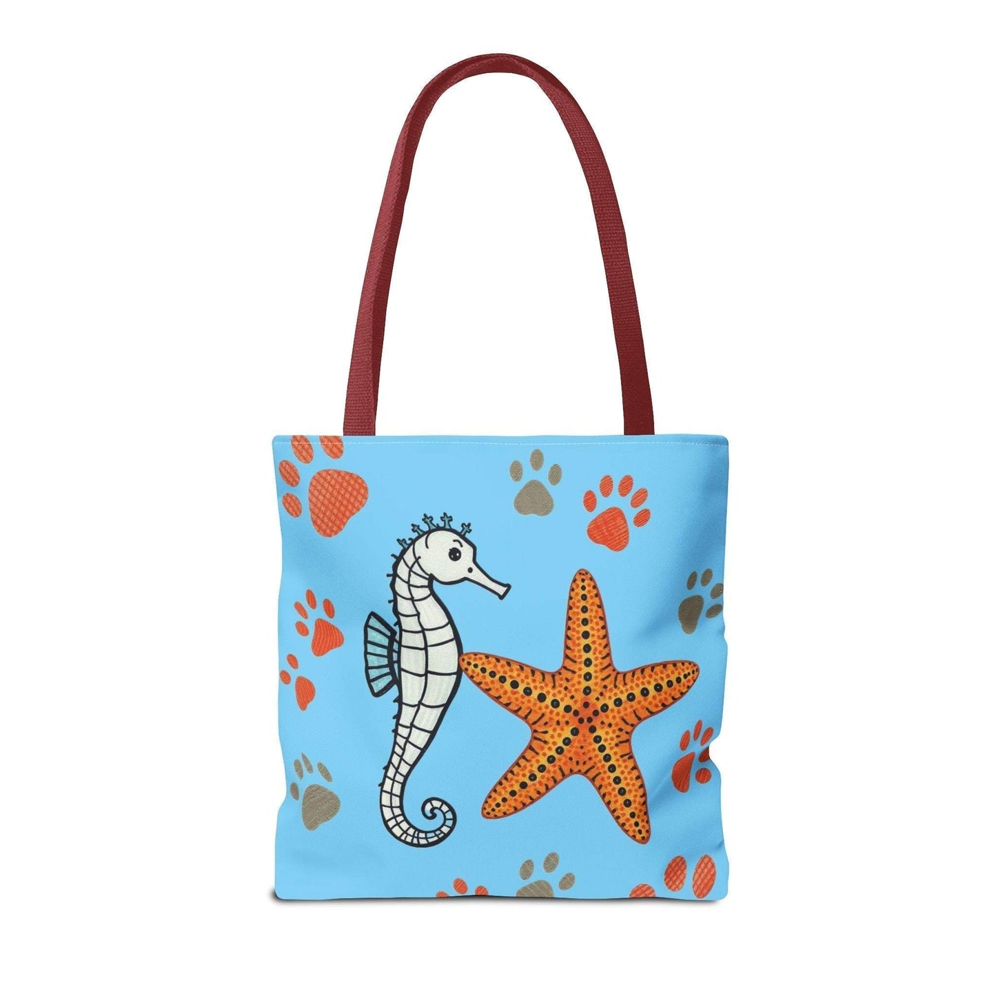 Ocean-inspired tote bag with seahorse and starfish design on blue background, perfect for beach days.