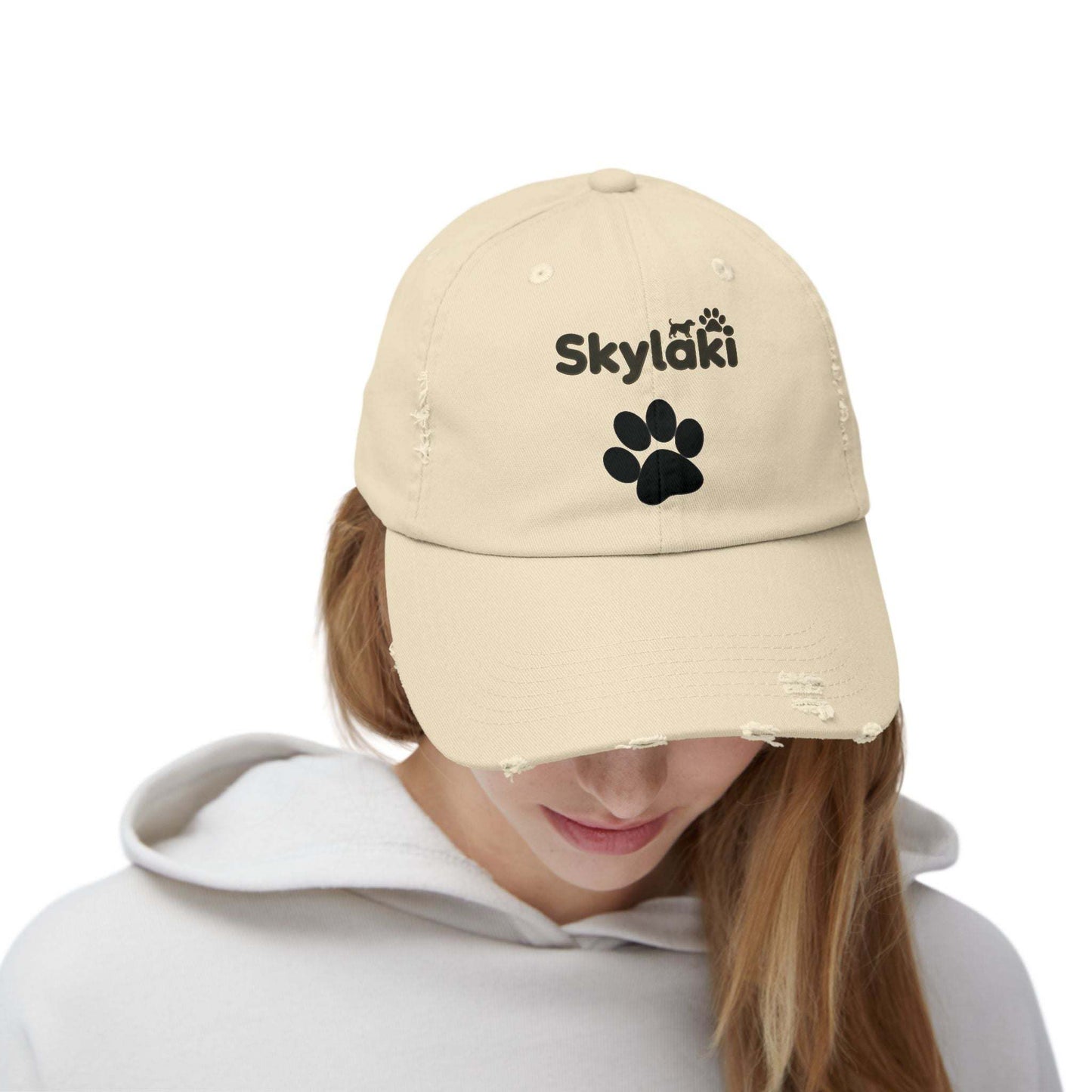 Unisex Distressed Cap with Skylaki Logo in cotton twill, worn by person.