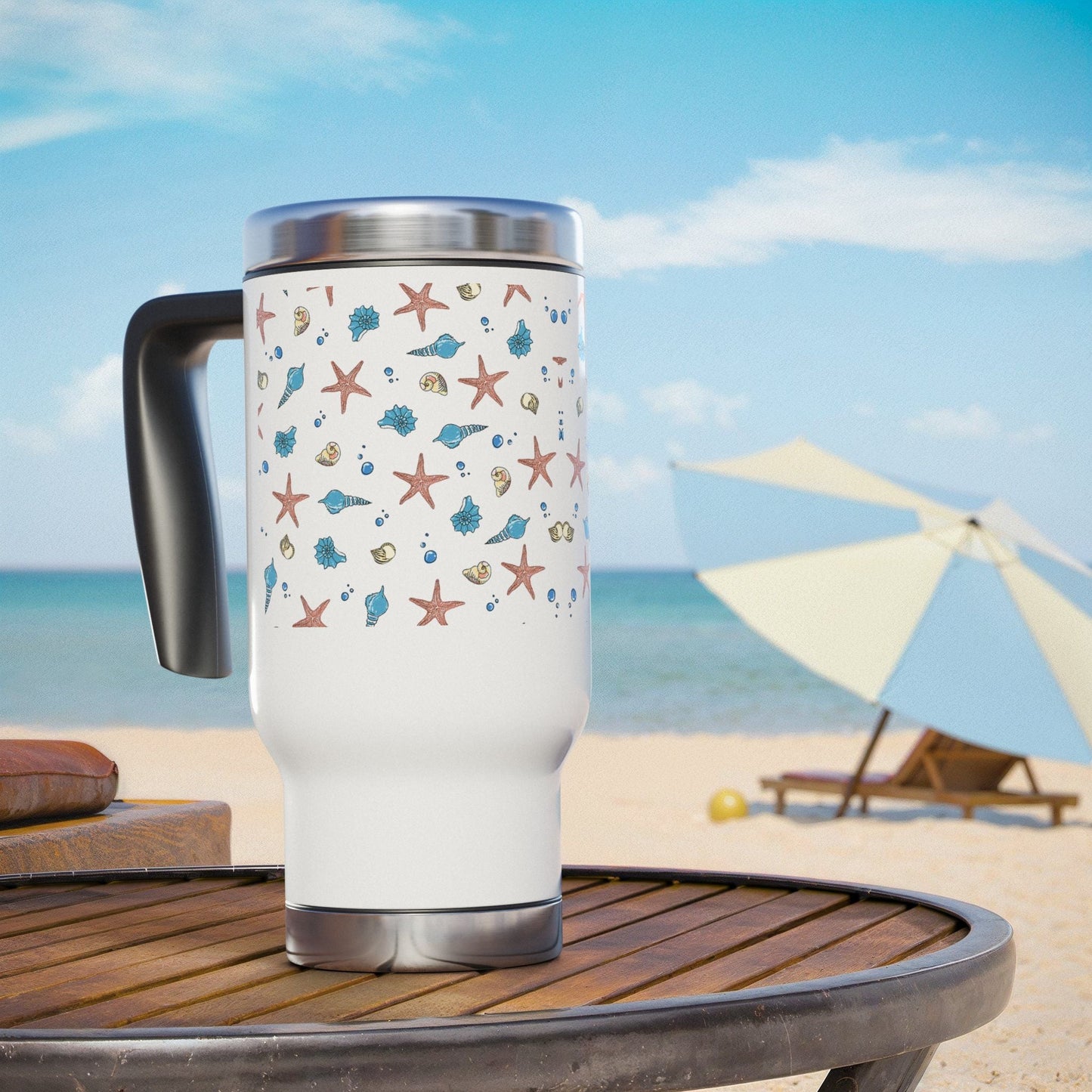 Beach-themed stainless steel coffee mug with handle, 14oz capacity, glossy white enamel finish, on outdoor table.