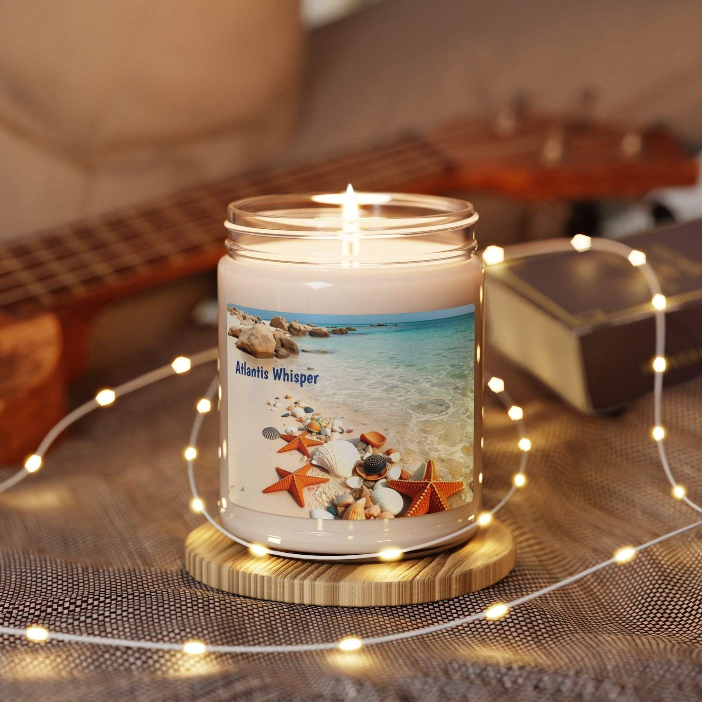 Scented soy candle Atlantis Whisper in decorative glass jar with beach scene, eco-friendly home fragrance.
