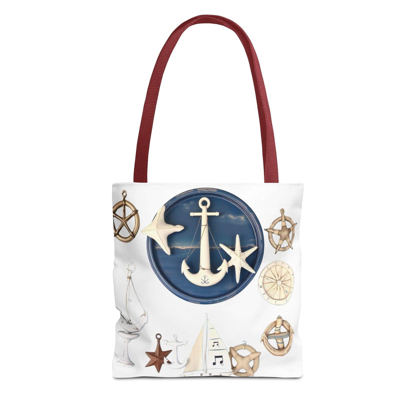 Nautical tote bag with anchor and star motif, featuring red handles and coastal design.