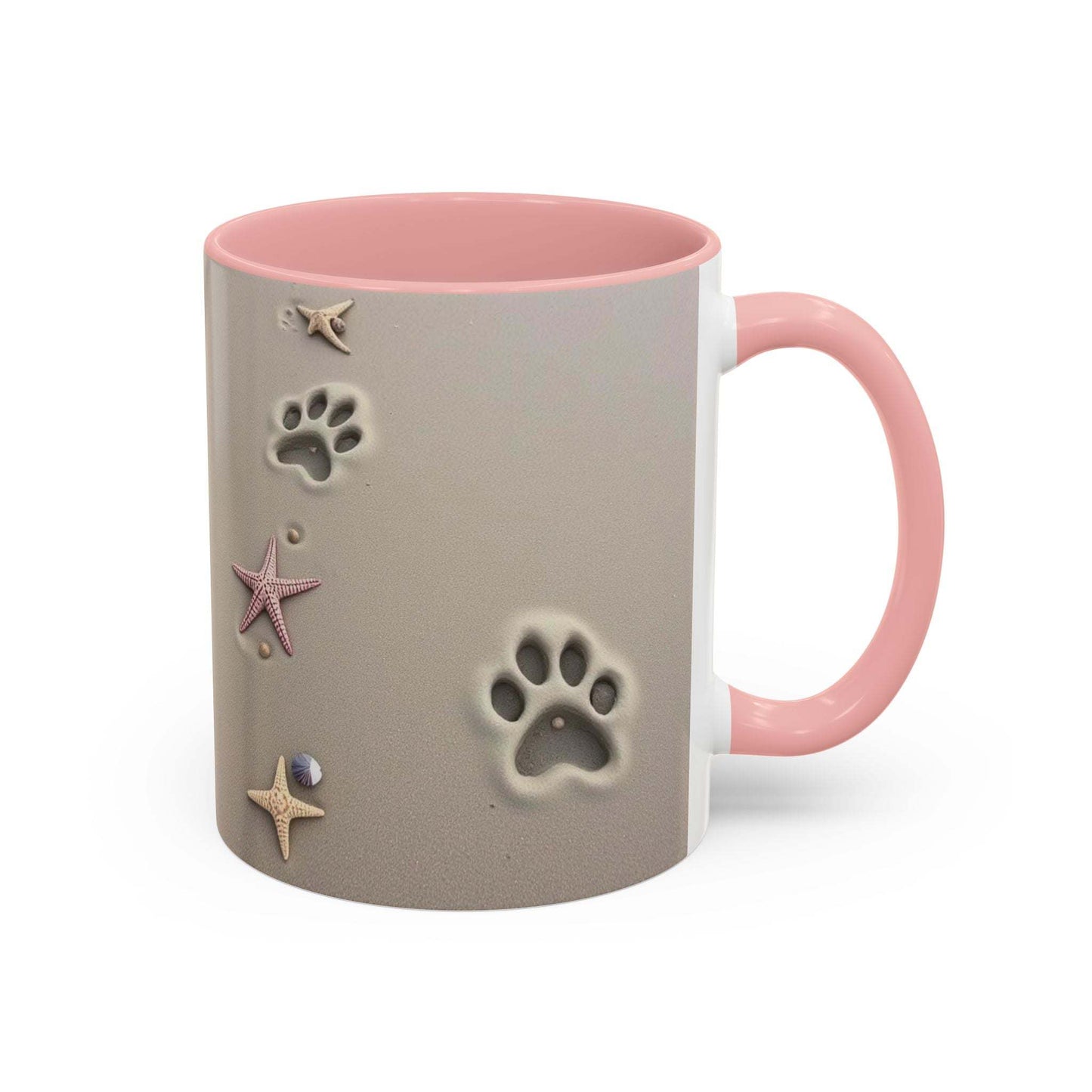 Nautical coffee mug with starfish and paw prints on beach-themed design, pink handle and interior.