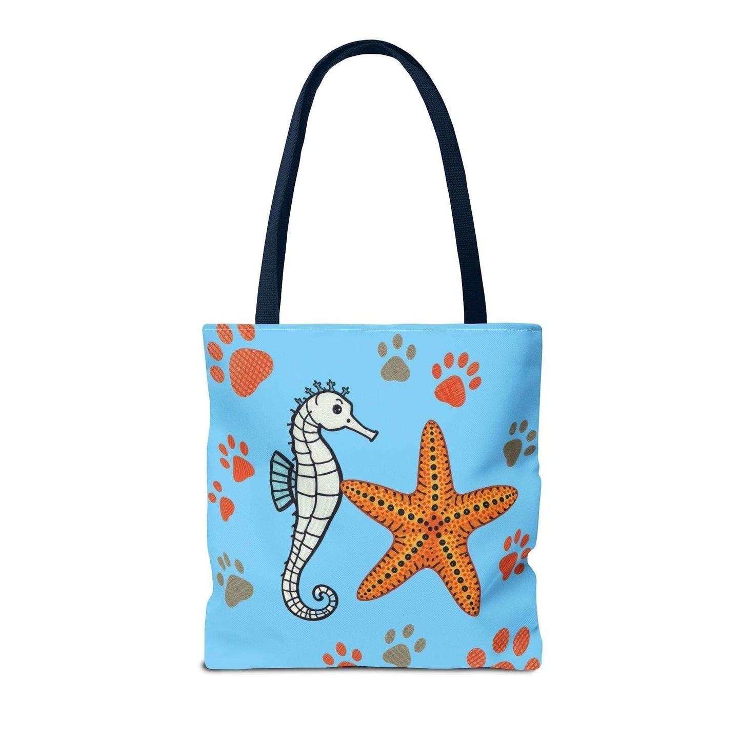 Tote bag with seahorse and starfish design on blue background, perfect for beach days and nature lovers.