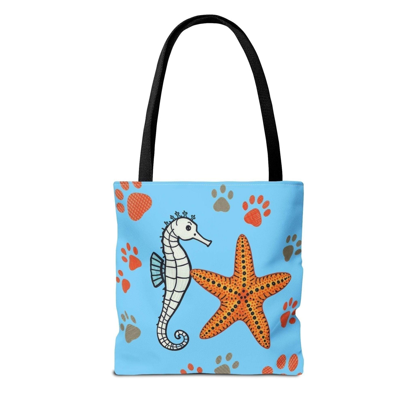 Ocean-inspired beach tote bag with seahorse and starfish design on blue background. Perfect for beach days.