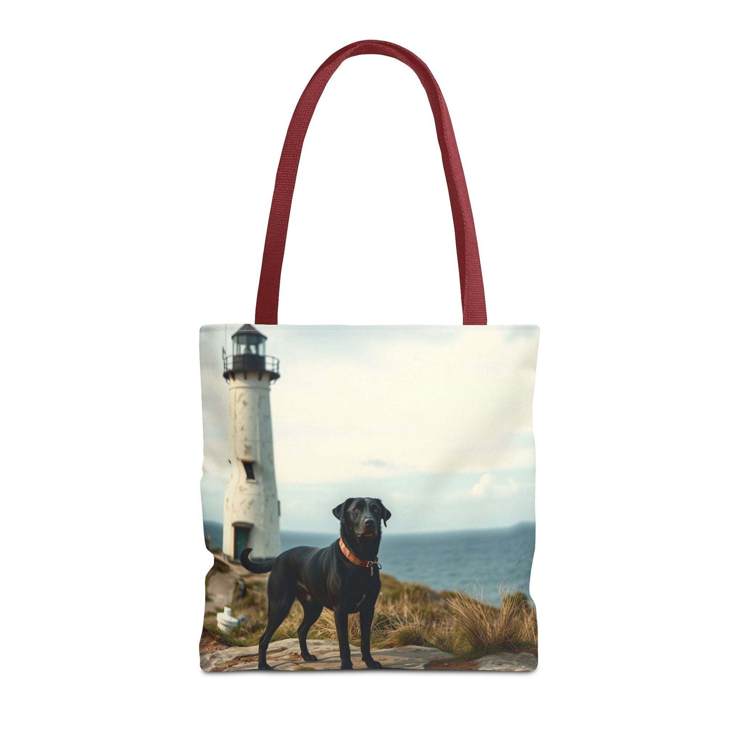 Coastal Canine Tote Bag with lighthouse and black dog design on a beach background, ideal for dog lovers and beach days.