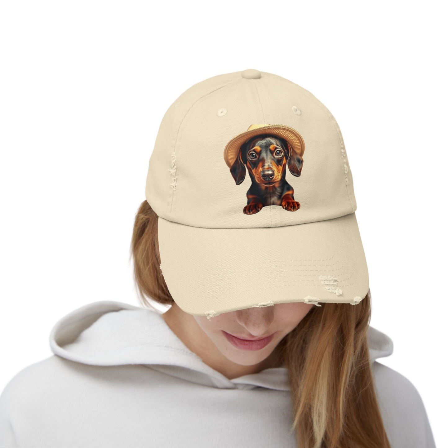 Distressed baseball cap with dachshund design worn by a person.