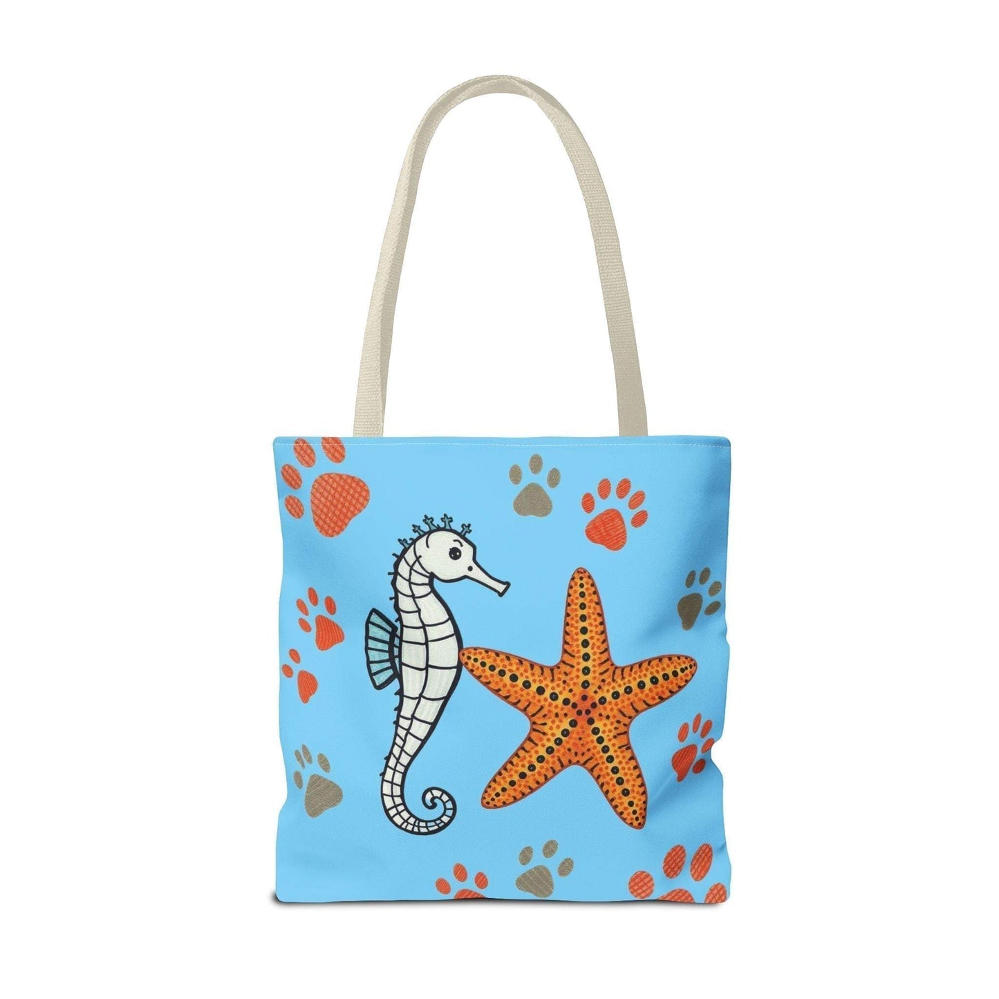 Tote bag with seahorse and starfish design on blue background, ideal for beach days and nature lovers.