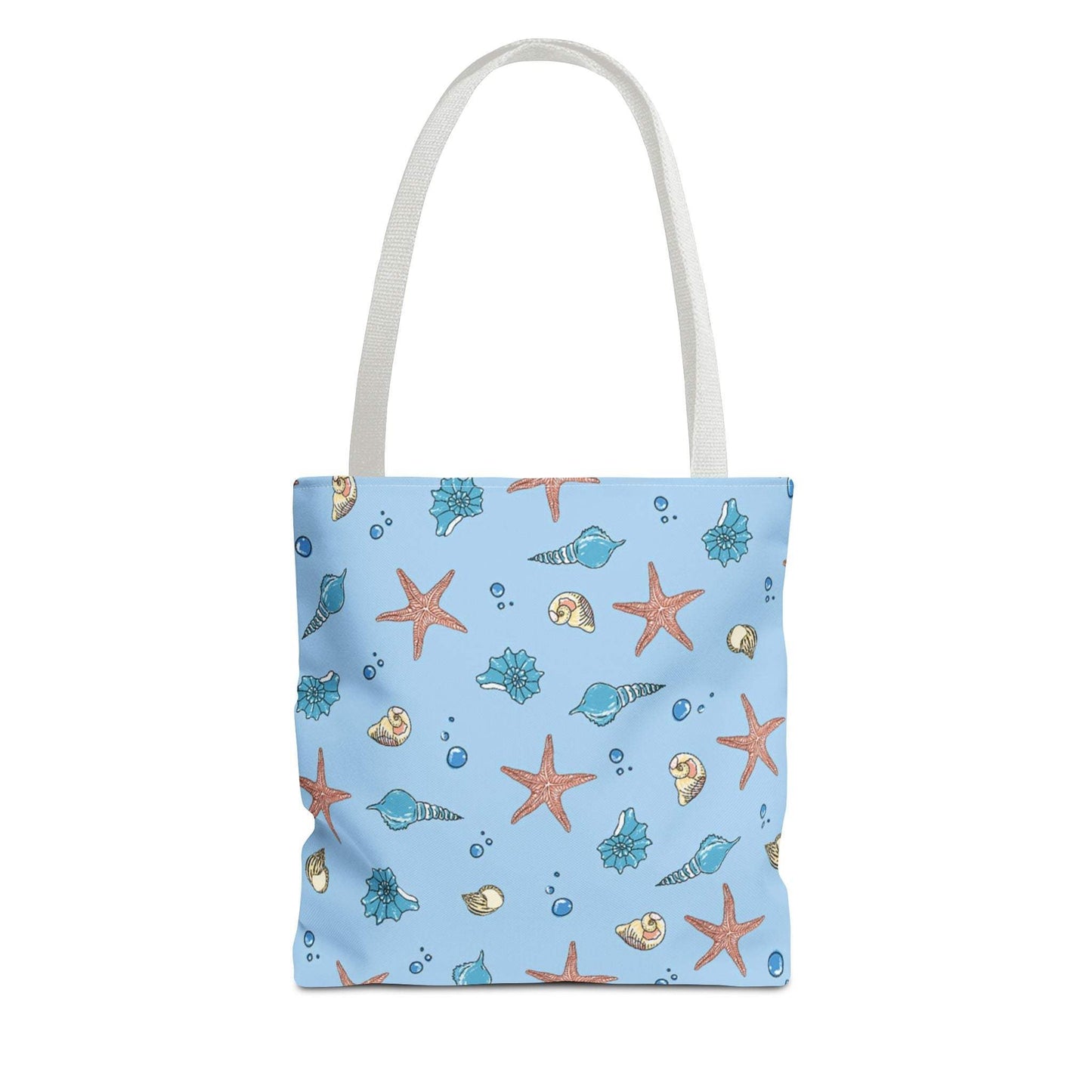 Beach tote bag with shell and starfish design, blue background, white handles.