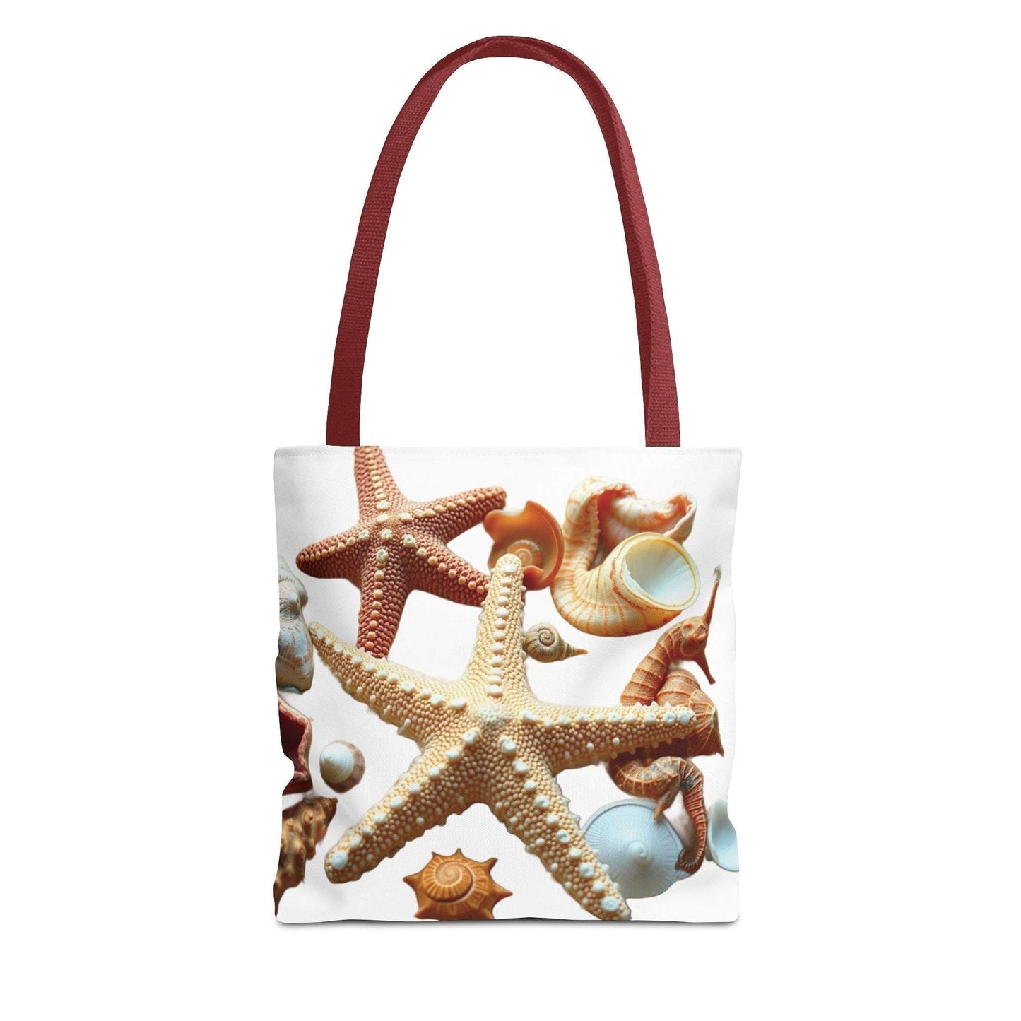 Beach tote bag with a starfish and seashell design, featuring maroon handles.