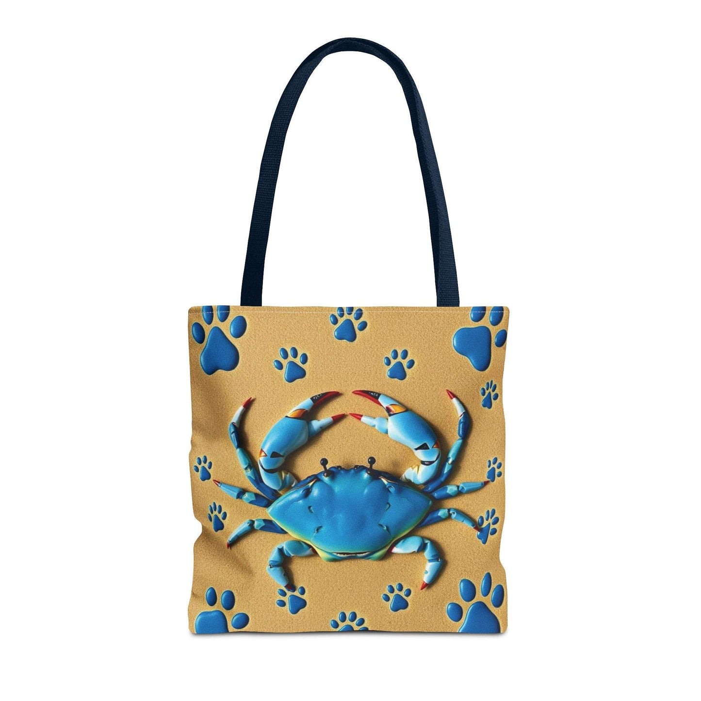 Blue Crab Pattern Tote Bag with navy handles on sand-colored background, ideal for beach and summer use.