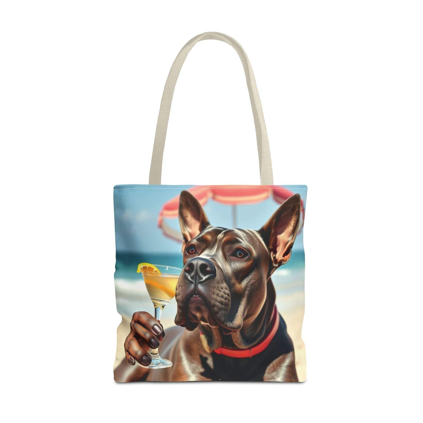 Cool Dog Tote Bag with playful dog and drink design on the beach, perfect for pet lovers and casual outings.