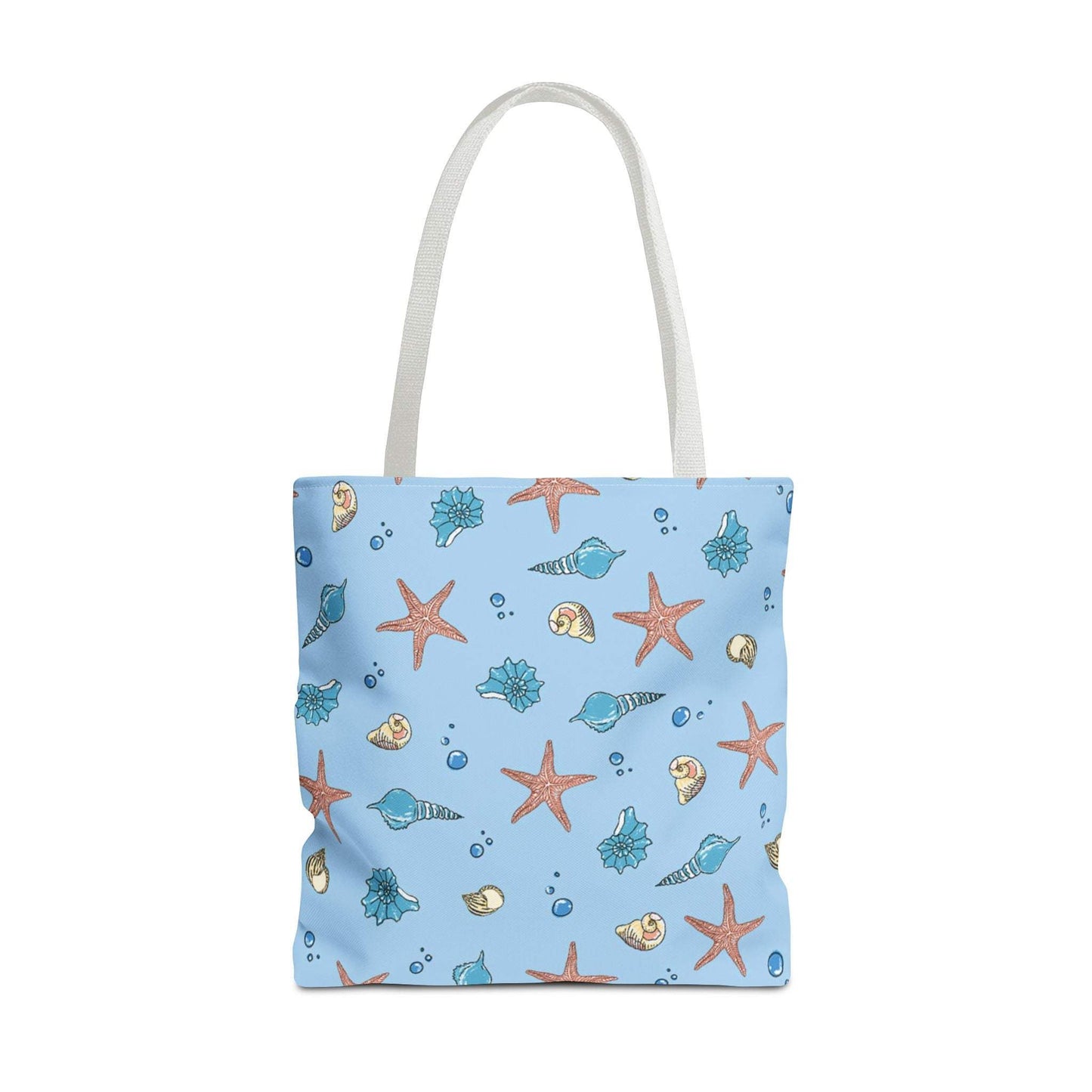 Beach tote bag with shell and starfish design on a light blue background, featuring durable handles and ocean-themed accents.