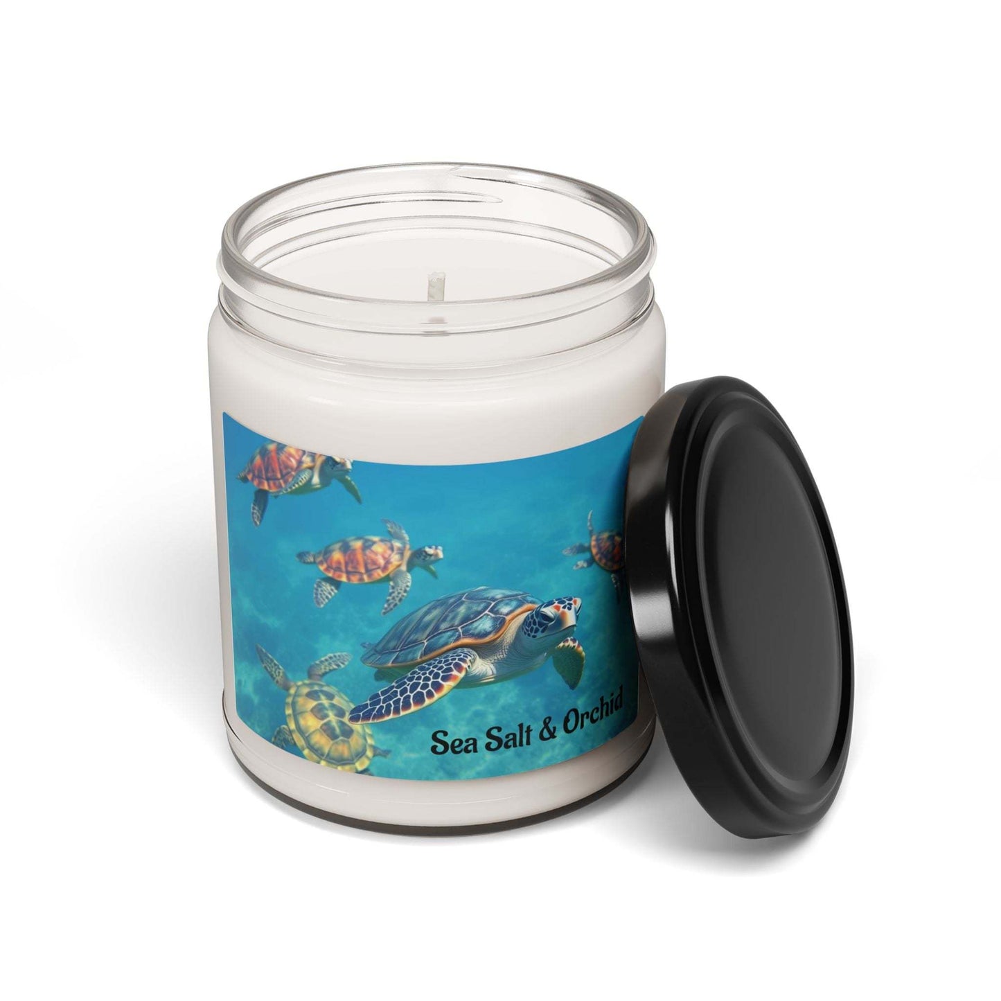 Soy candle with tropical sea salt and orchid scent in a reusable glass jar with marine turtle design.
