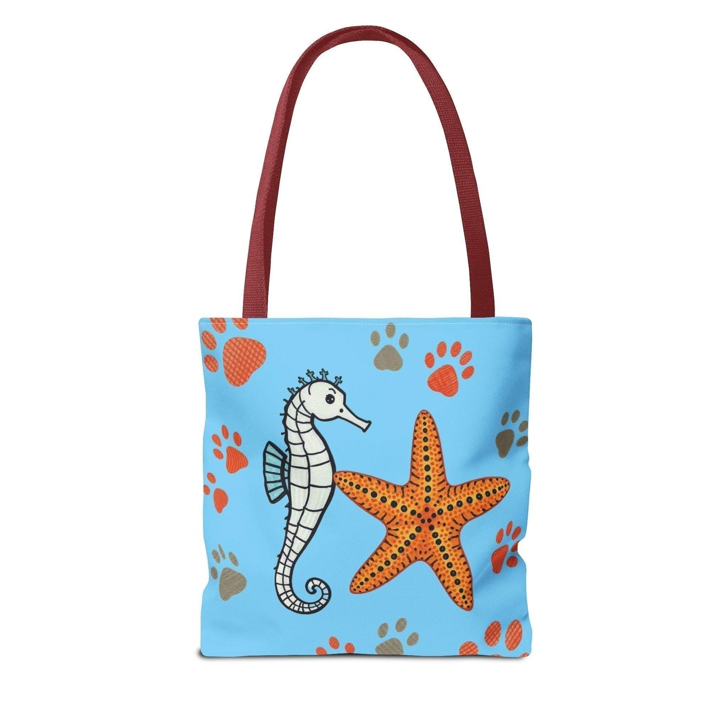 Ocean-inspired beach tote bag with seahorse and starfish design on blue background.