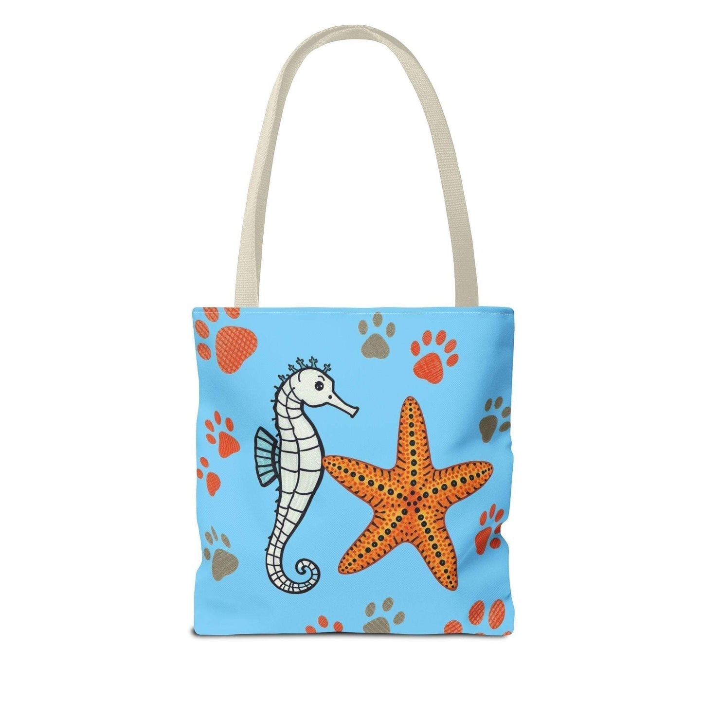 Ocean-inspired tote bag with seahorse and starfish design on a blue background.