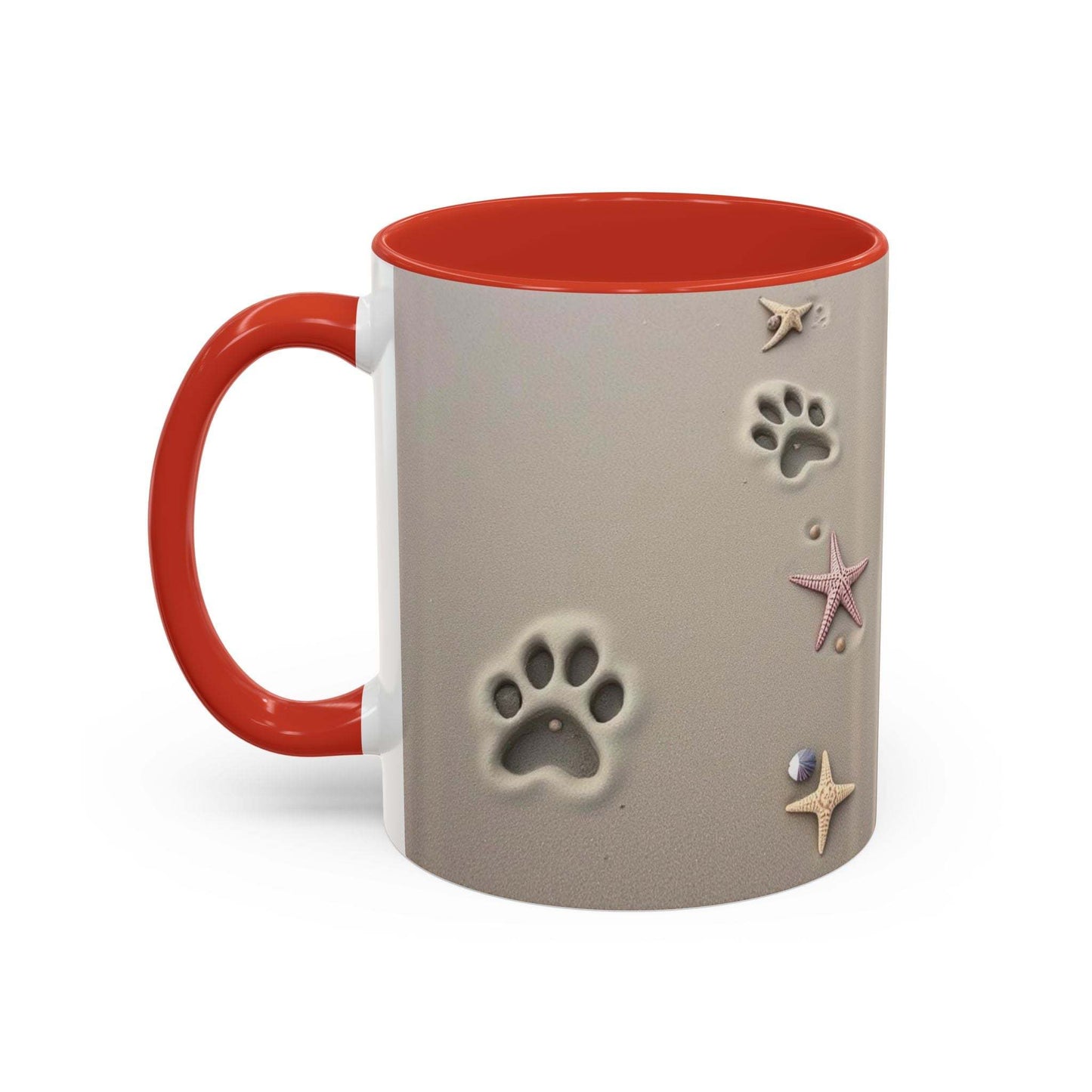 Nautical coffee mug with starfish and paw prints design, red handle, beach theme.