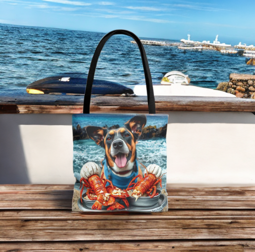 Happy Dog Lobster Tote Bag by the beach, featuring a vibrant dog and lobster design, perfect for pet lovers and beach trips.
