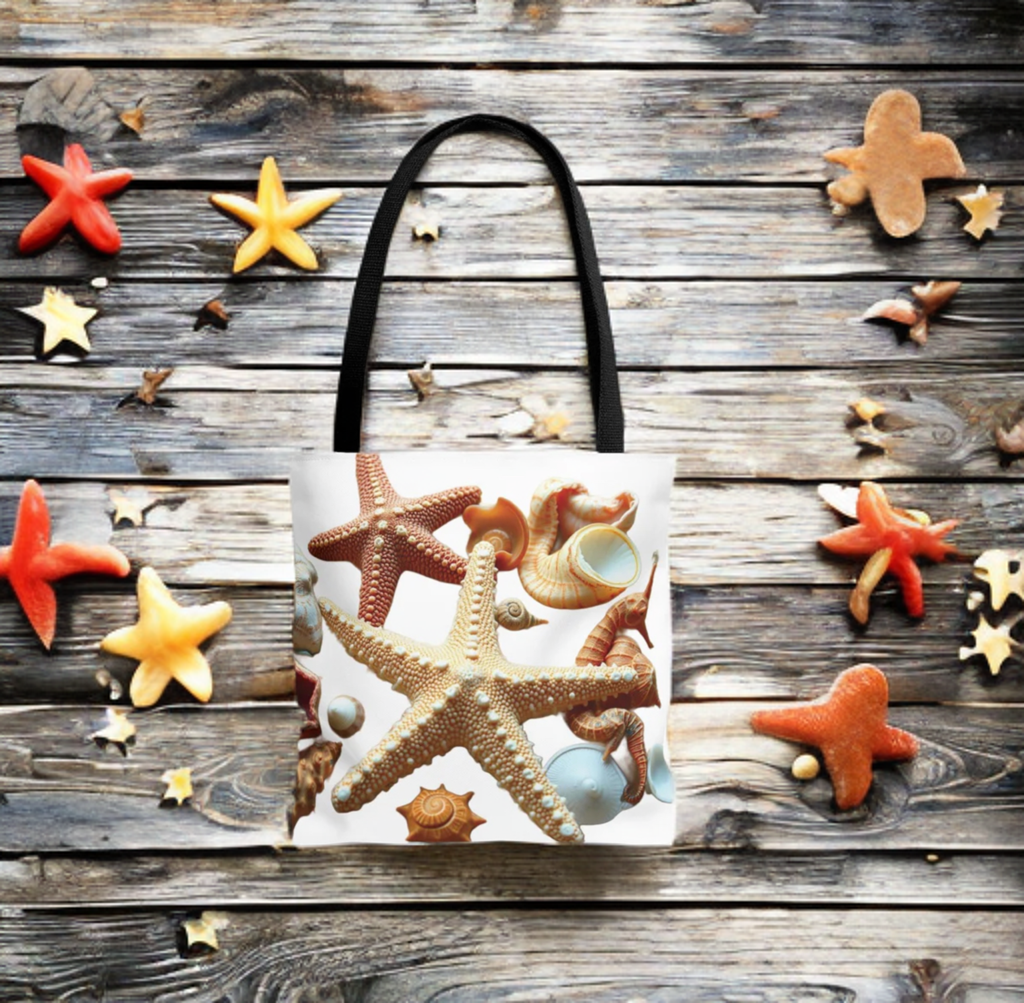 Beach tote bag with seashell and starfish design on wooden background.