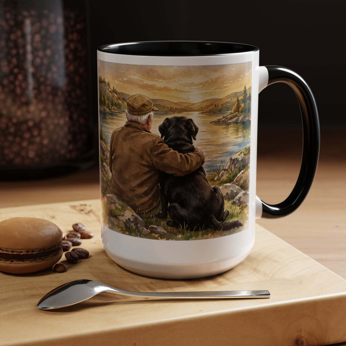 Man and Dog Watching Sunset ceramic mug with black interior and handle, featuring painted figures beside calm water