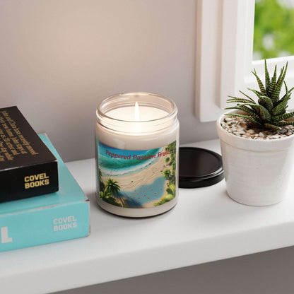 Tropical Paradise Scented Soy Candle - 9oz with beach-themed label on a table next to books and a potted plant.