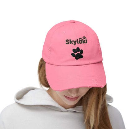 Unisex distressed cap with Skylaki logo in pink.