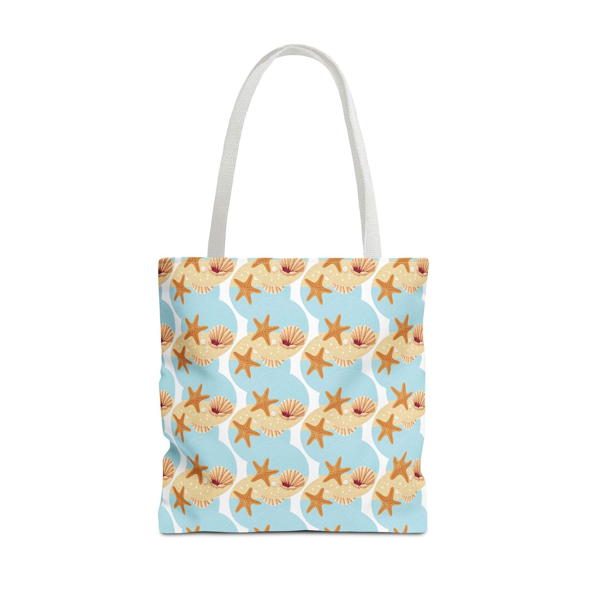 Seashell and starfish beach tote bag with coastal pattern in blue and beige, perfect for summer outings.