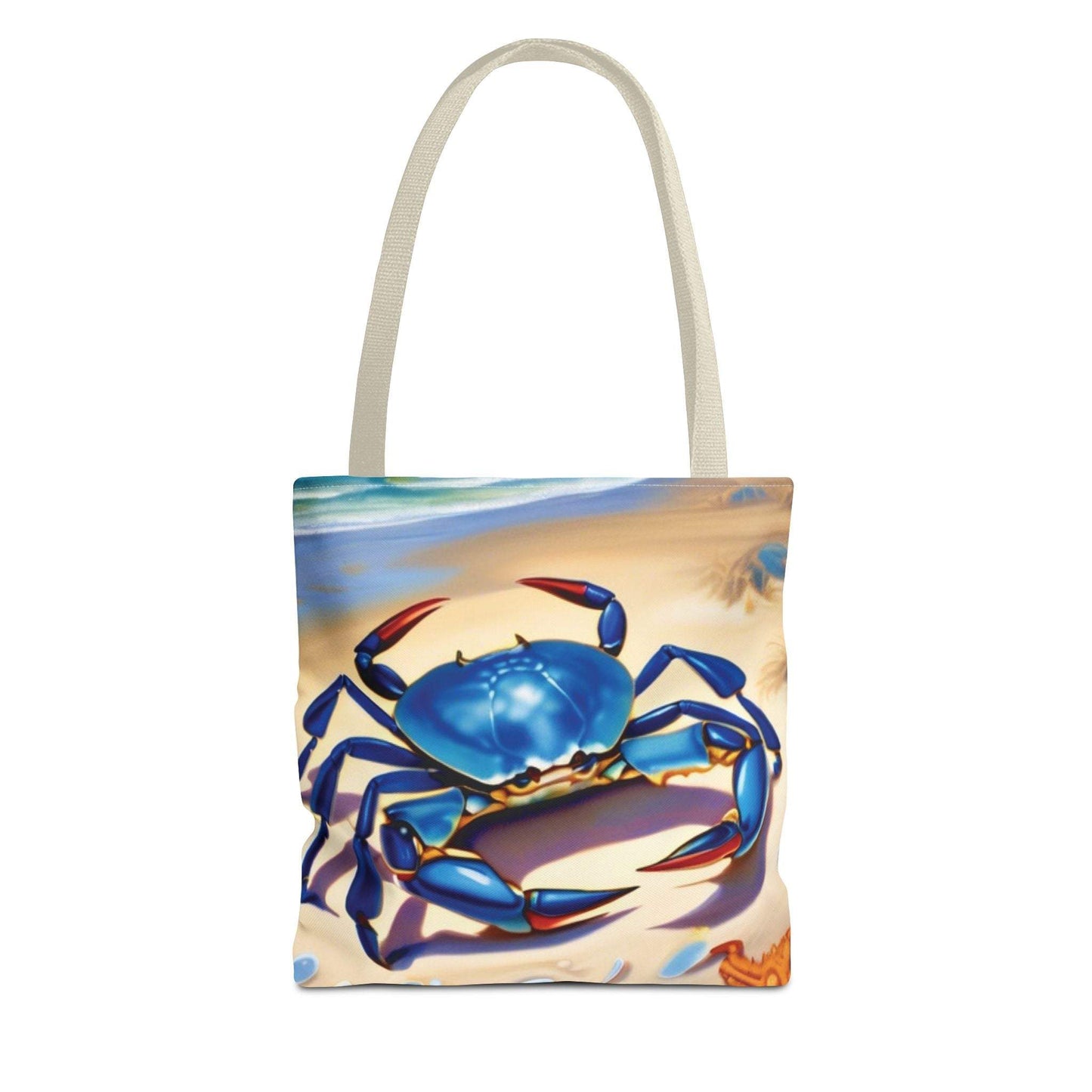 Ocean-inspired beach bag tote with blue crab design on beach backdrop.