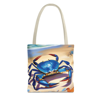 Ocean-inspired beach bag tote with blue crab design on beach backdrop.