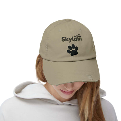 Unisex distressed cap with Skylaki logo, 100% cotton twill, adjustable fit, DTF printed.