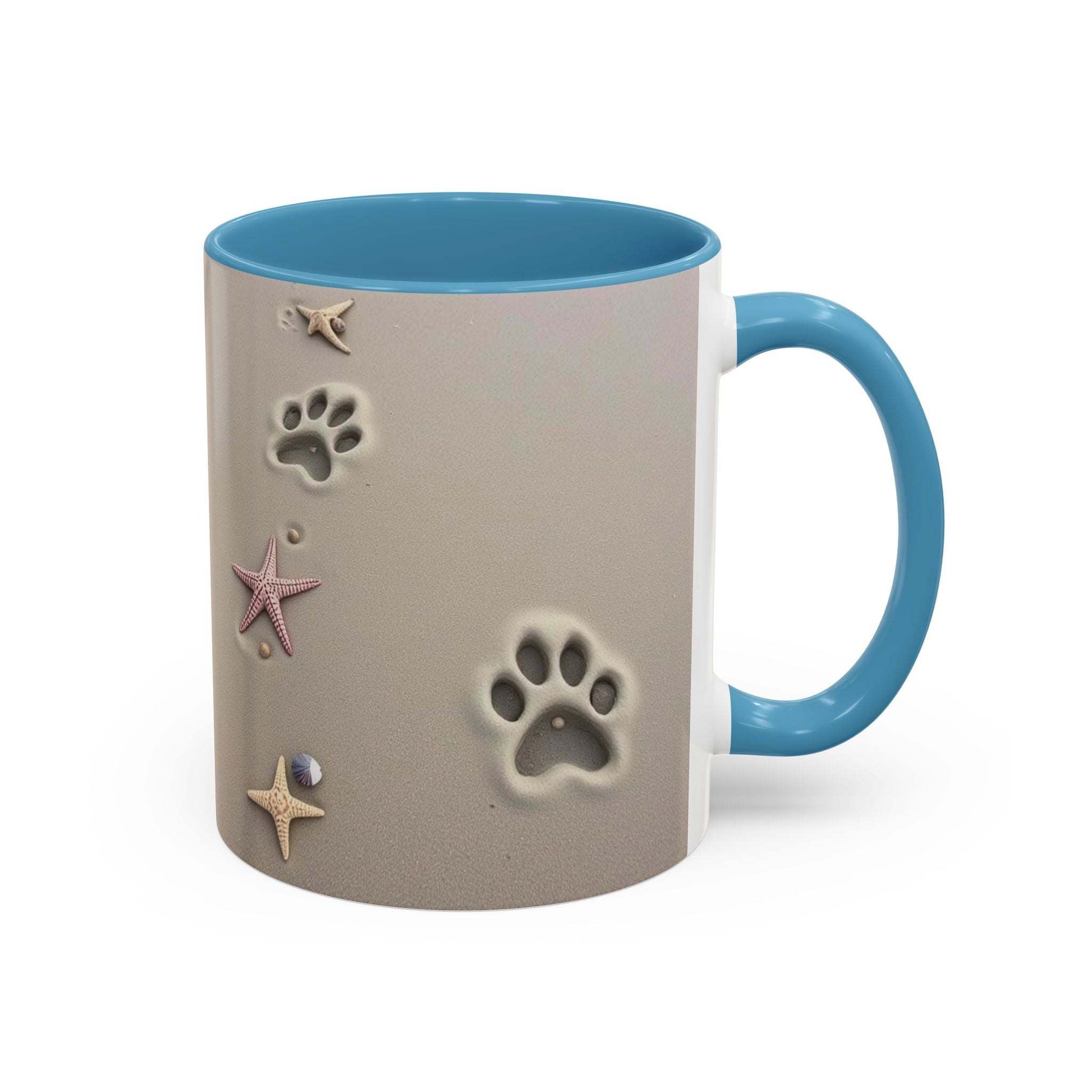 Nautical coffee mug with starfish and paw prints design in vibrant colors.