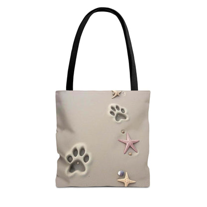 Beach tote bag with paw print and starfish design, ideal for pet lovers and beach outings.