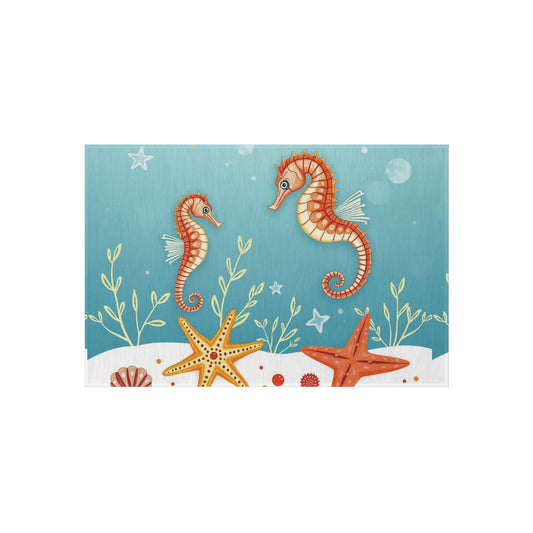 Nautical outdoor rug with seahorse and starfish design, featuring vibrant ocean-inspired decor, perfect for patios and gardens.