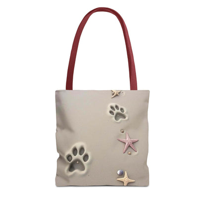 Beach tote bag with paw print and starfish design, perfect for pet lovers and beach outings.
