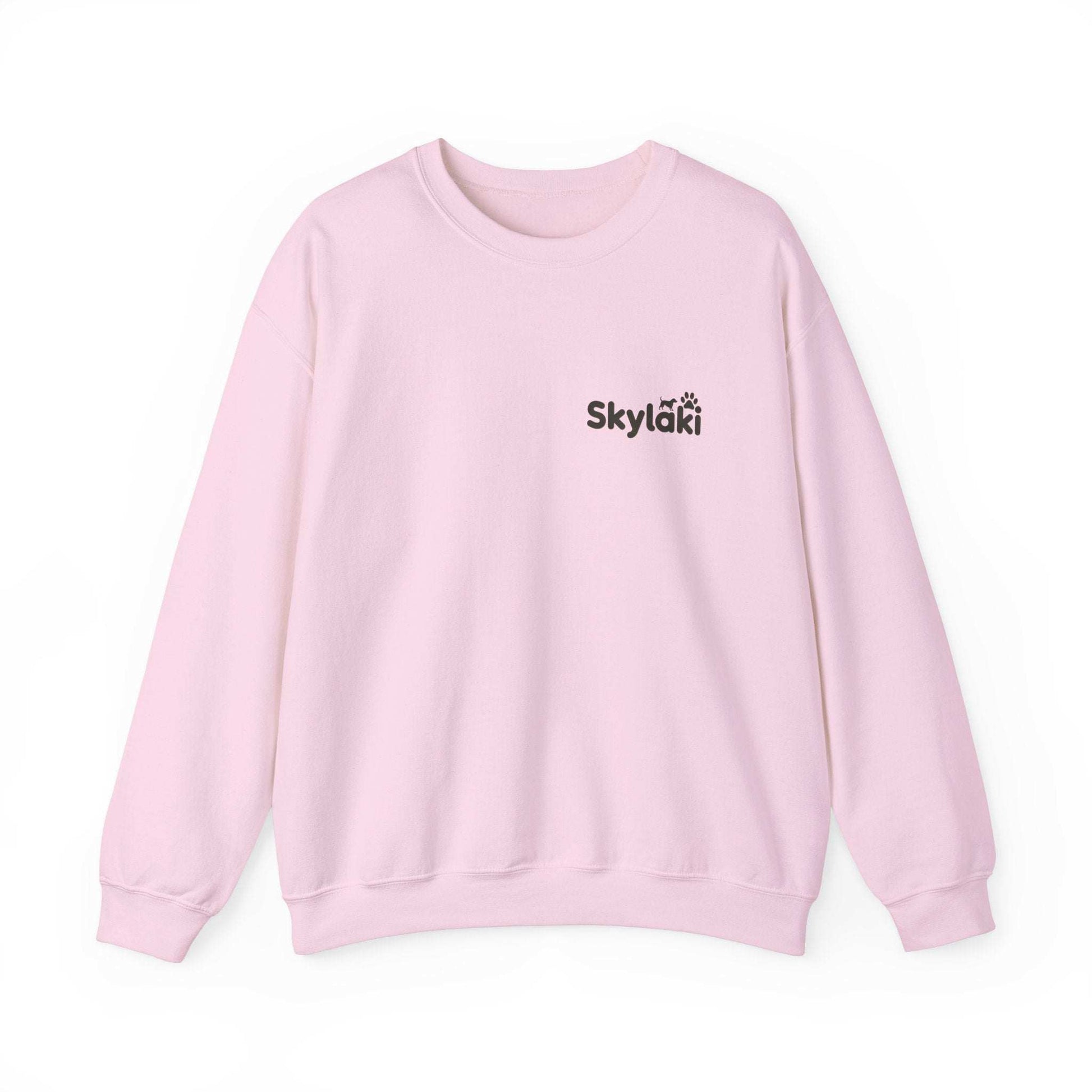Skylaki Heavy Blend™ Crewneck Sweatshirt in pink, unisex style with logo, ideal for casual warmth.