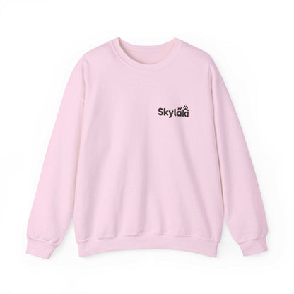 Skylaki Heavy Blend™ Crewneck Sweatshirt in pink, unisex style with logo, ideal for casual warmth.