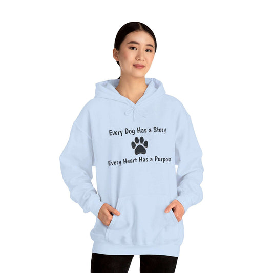 Unisex hooded sweatshirt with "Every Dog Has a Story" message, worn by model.