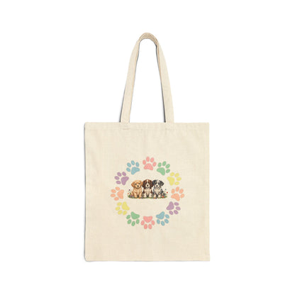 Natural canvas tote bag with colorful rainbow dog paw prints arranged in a circular wreath - Skylaki brand