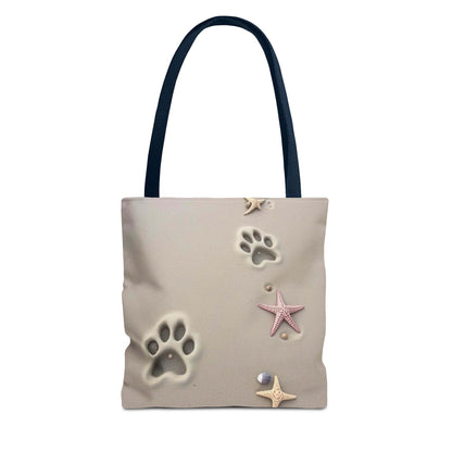 Beach tote bag with paw print and starfish design, ideal for pet lovers and beach outings.