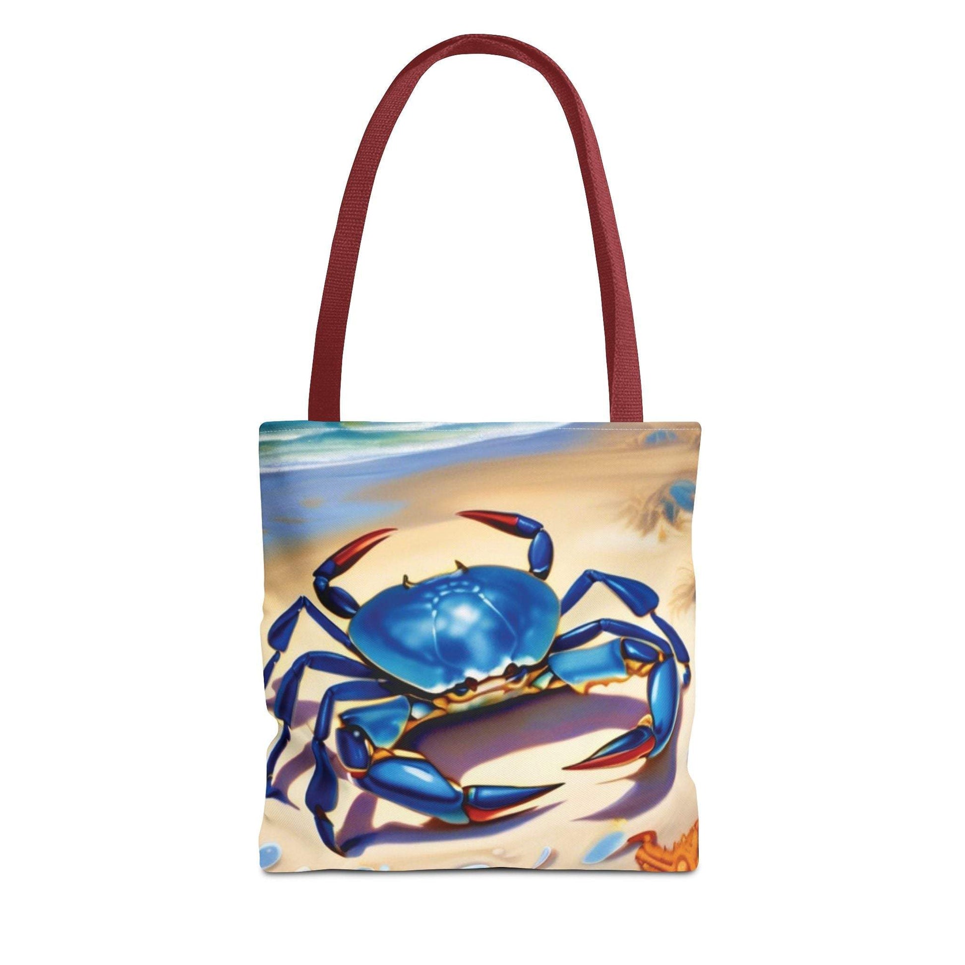 Ocean-inspired beach bag tote with blue crab and starfish design on a beach backdrop.