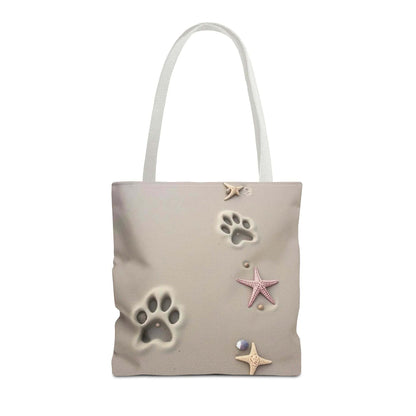Beach tote bag with paw print and starfish design, ideal for pet lovers and beach outings.