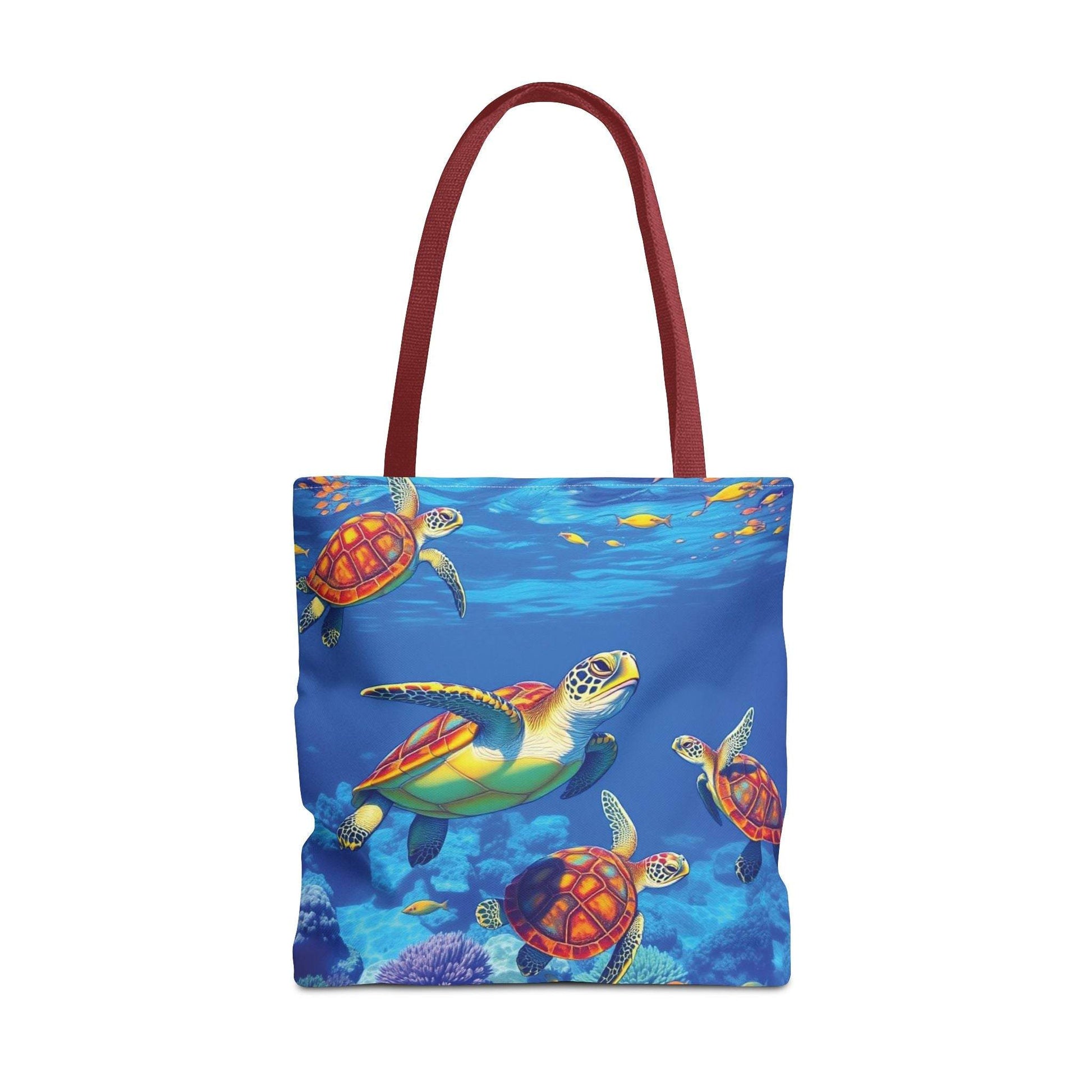 Tote bag with colorful underwater turtle design and red handles.