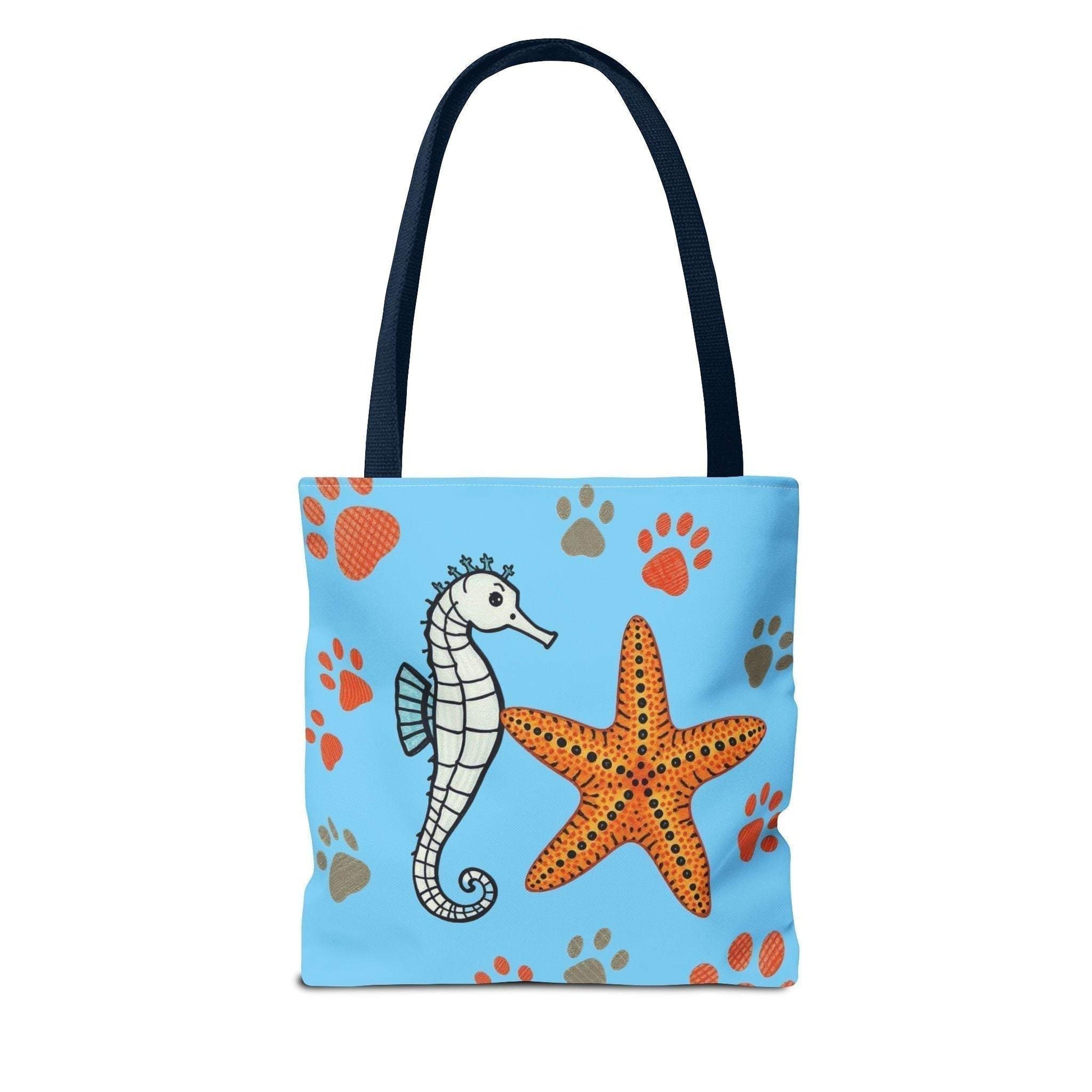 Ocean-inspired tote bag with seahorse and starfish design on blue background, ideal for beach lovers.