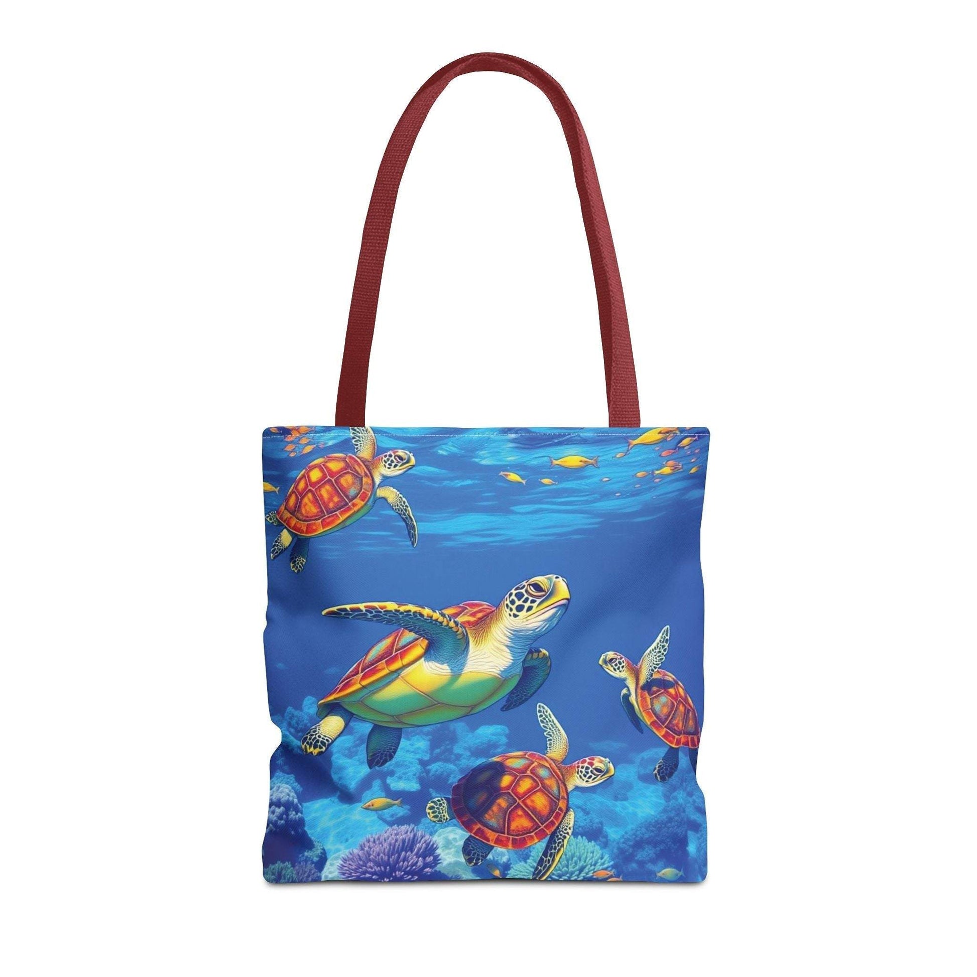 Colorful tote bag with an underwater turtle design, featuring vibrant ocean life and red handles.