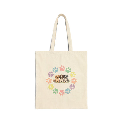 Natural canvas tote bag with colorful rainbow dog paw prints arranged in a circular wreath - Skylaki brand