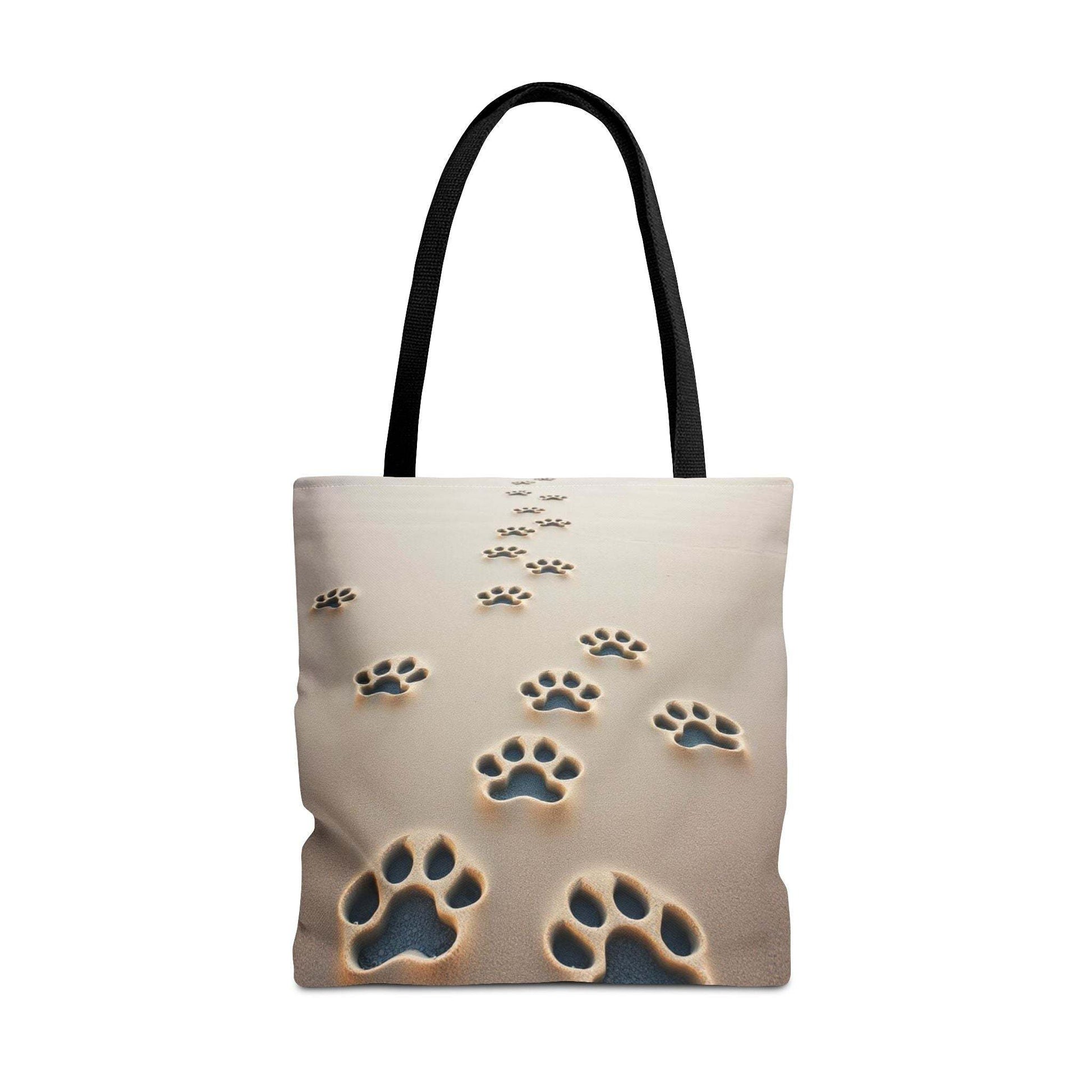 Paw Print Tote Bag with Black Handles on Sand Background