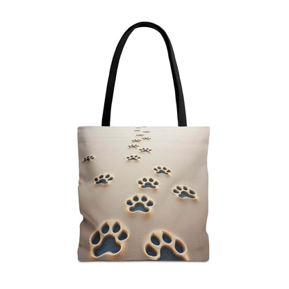 Paw Print Tote Bag with Black Handles on Sand Background