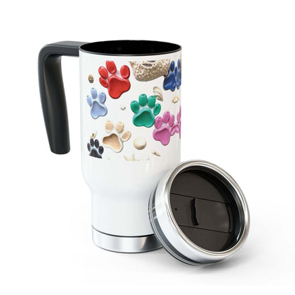 Stainless steel travel mug with handle, featuring colorful paw prints, glossy white enamel, and a spill-resistant cap.
