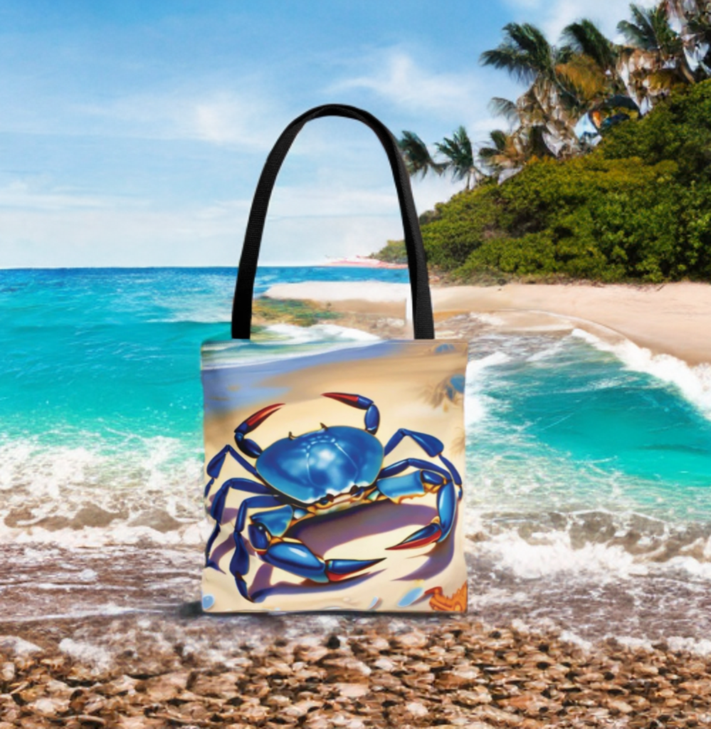 Beach bag tote with blue crab and starfish design on beach backdrop.