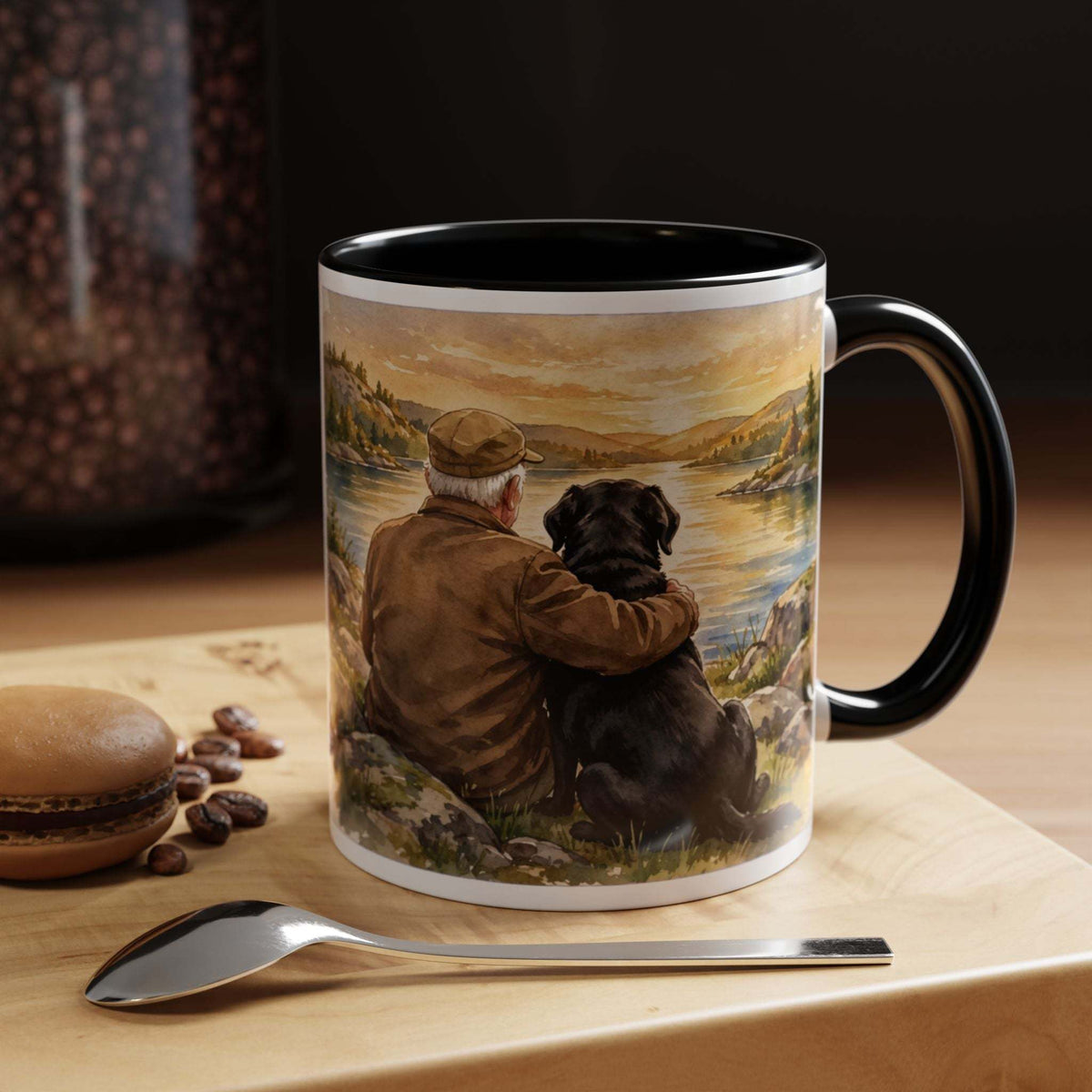 Ceramic mug featuring Man and Dog Watching Sunset, with a painted shoreline scene and glossy black interior and handle