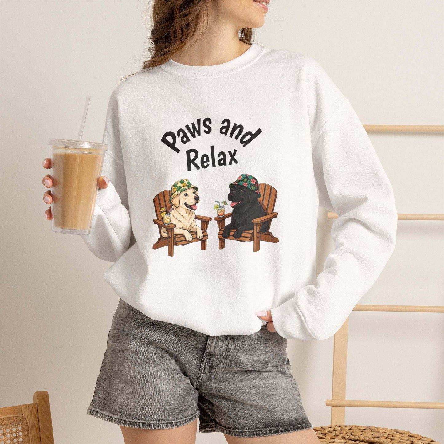 Black and white Paws and Relax dog sweatshirt with two dogs lounging illustration